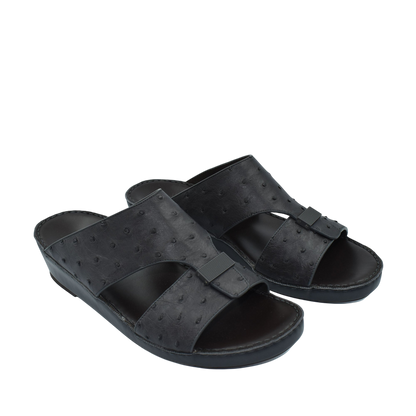 Black ostrich leather sandals with open toe and slip-on design for casual comfort