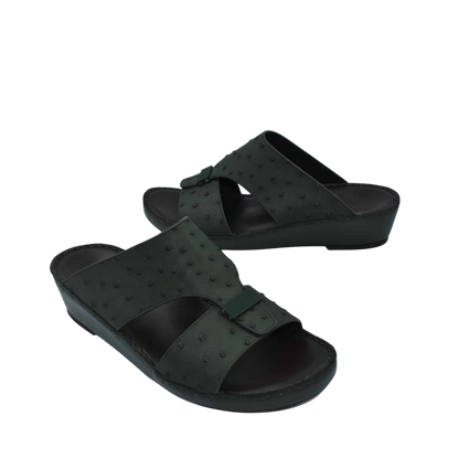 Black ostrich leather sandals with adjustable buckle straps and comfortable wedge sole