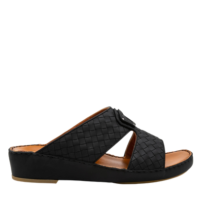 Side view of black Peninsula Classica Trecce sandals with woven leather upper and cushioned sole