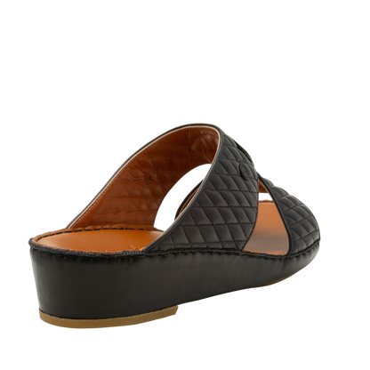 Black Peninsula Lamb Matelasse sandals with quilted leather straps and cushioned tan insole