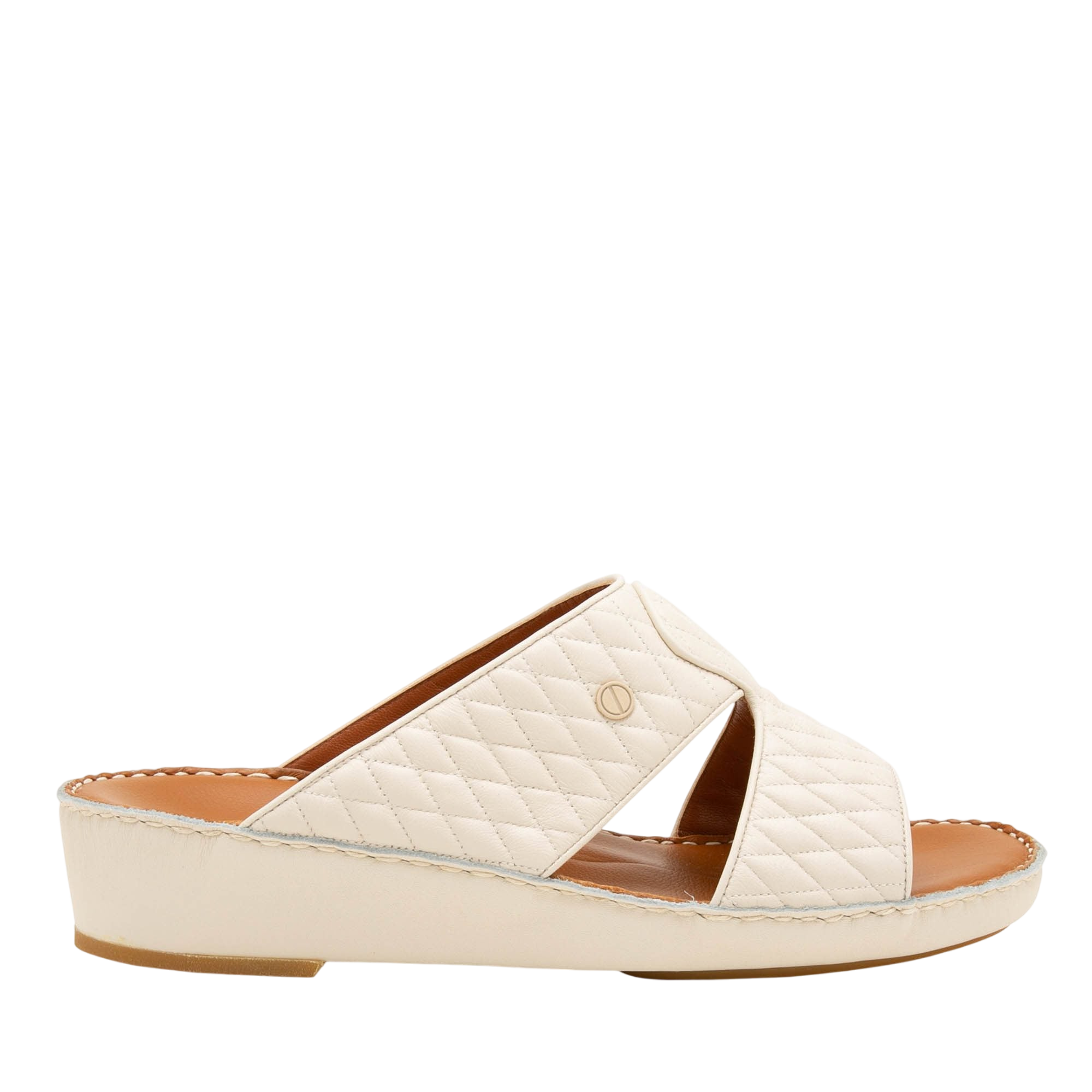 Cream-colored Peninsula Lamb Matelasse sandals with quilted design and open toe on wedge sole