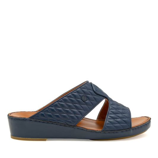 Navy blue Peninsula Lamb Matelasse sandals with quilted leather upper and comfortable low wedge sole