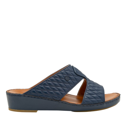 Navy blue Peninsula Lamb Matelasse sandals with quilted leather upper and comfortable low wedge sole
