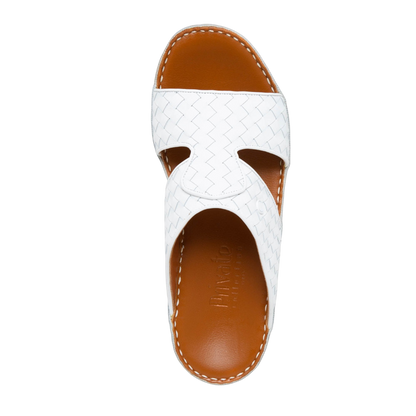 White Peninsula Trecce sandals with woven leather straps and brown cushioned footbed for comfort