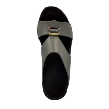 Top view of premium Deercalf footwear slide sandal with black sole and olive leather strap