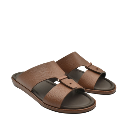 Brown premium leather sandal with dual straps and cushioned footbed for comfortable wear