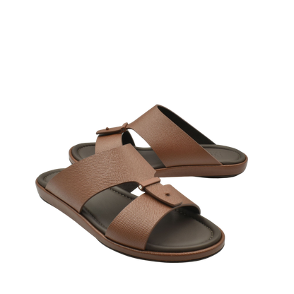 Brown premium leather sandal with adjustable strap and cushioned sole for comfortable wear
