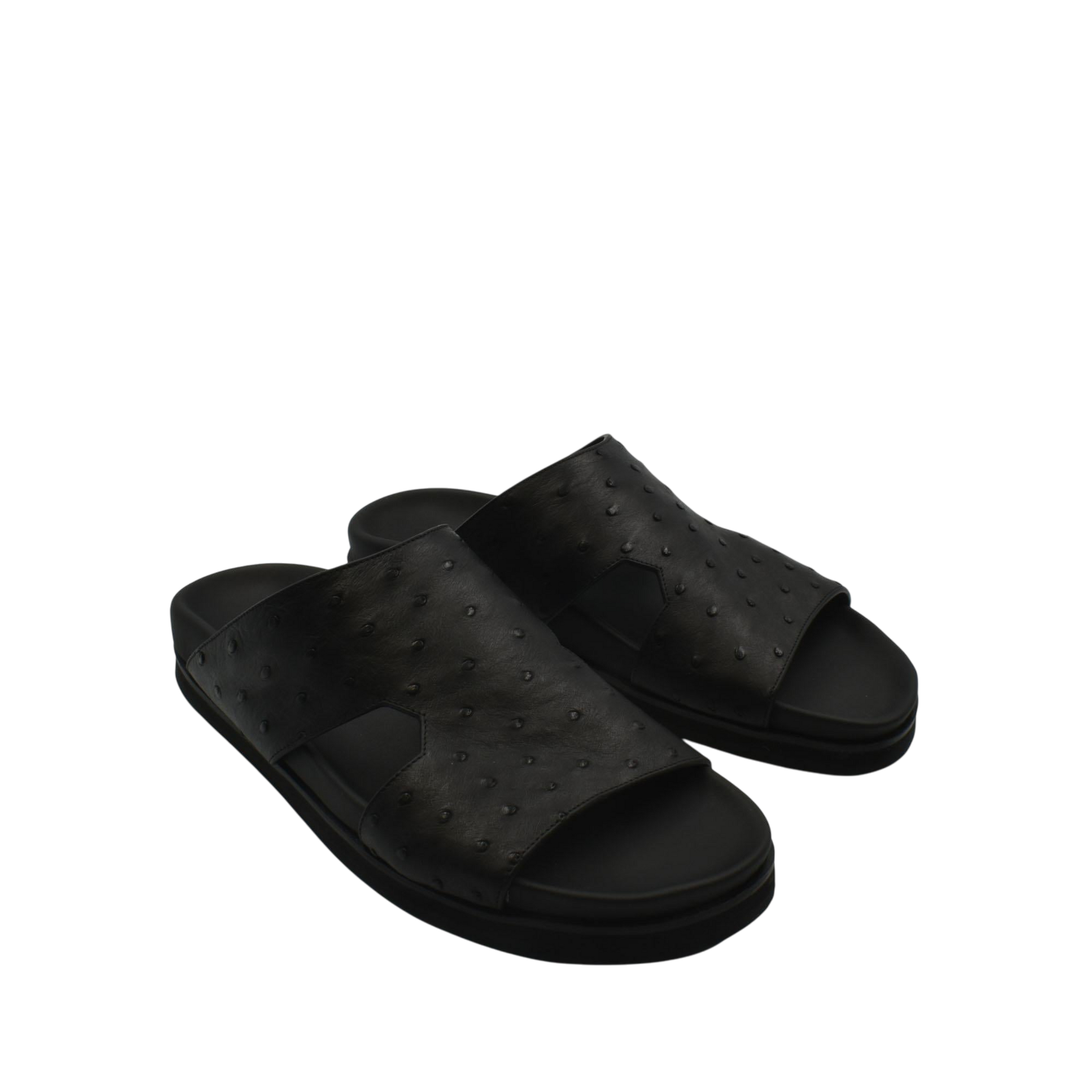 Black slip-on premium ostrich leather footwear sandals with textured upper and cushioned sole