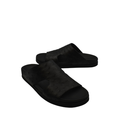 Black premium ostrich leather footwear slide sandals with textured upper and cushioned sole