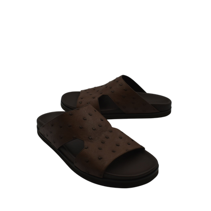 Brown slip-on sandals made of premium ostrich leather footwear with textured pattern and black sole