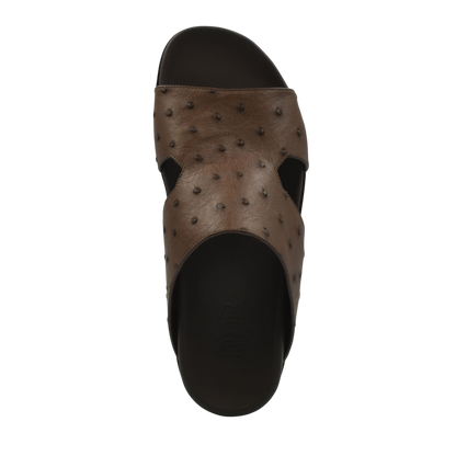 Premium ostrich leather footwear brown slide sandal with textured leather upper and black sole
