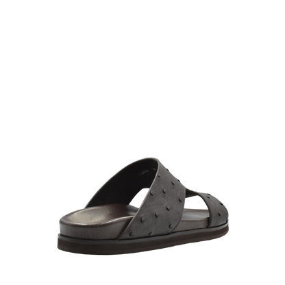 Black slip-on sandal made from premium ostrich leather footwear with textured design