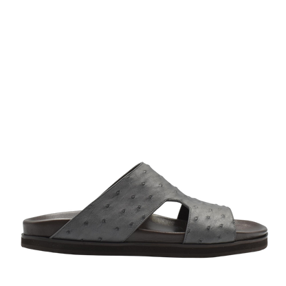 Black slide sandal made of premium ostrich leather footwear with textured leather and open design