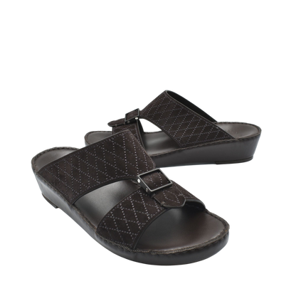 Pair of black premium suede sandals with adjustable buckle straps and cushioned sole