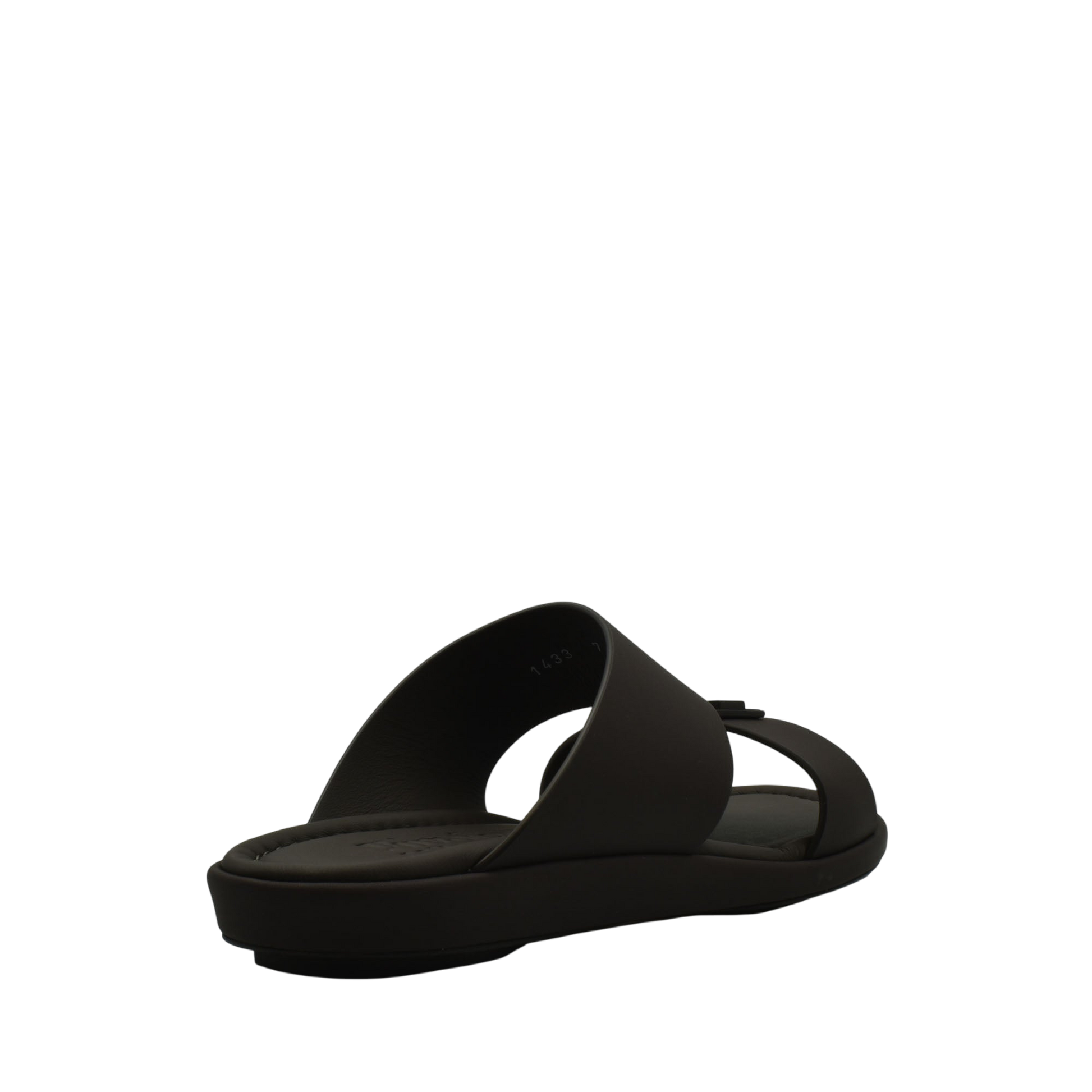 Black slide sandal from Private Collection representing prestige casual footwear with a sleek modern design