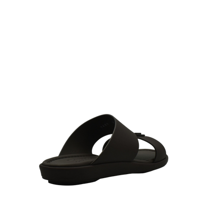 Black slide sandal from Private Collection representing prestige casual footwear with a sleek modern design