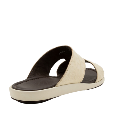 Beige prestige croco sandals with textured straps and black cushioned footbed for comfort