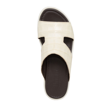 Top view of beige prestige croco sandals with textured straps and cushioned dark brown footbed