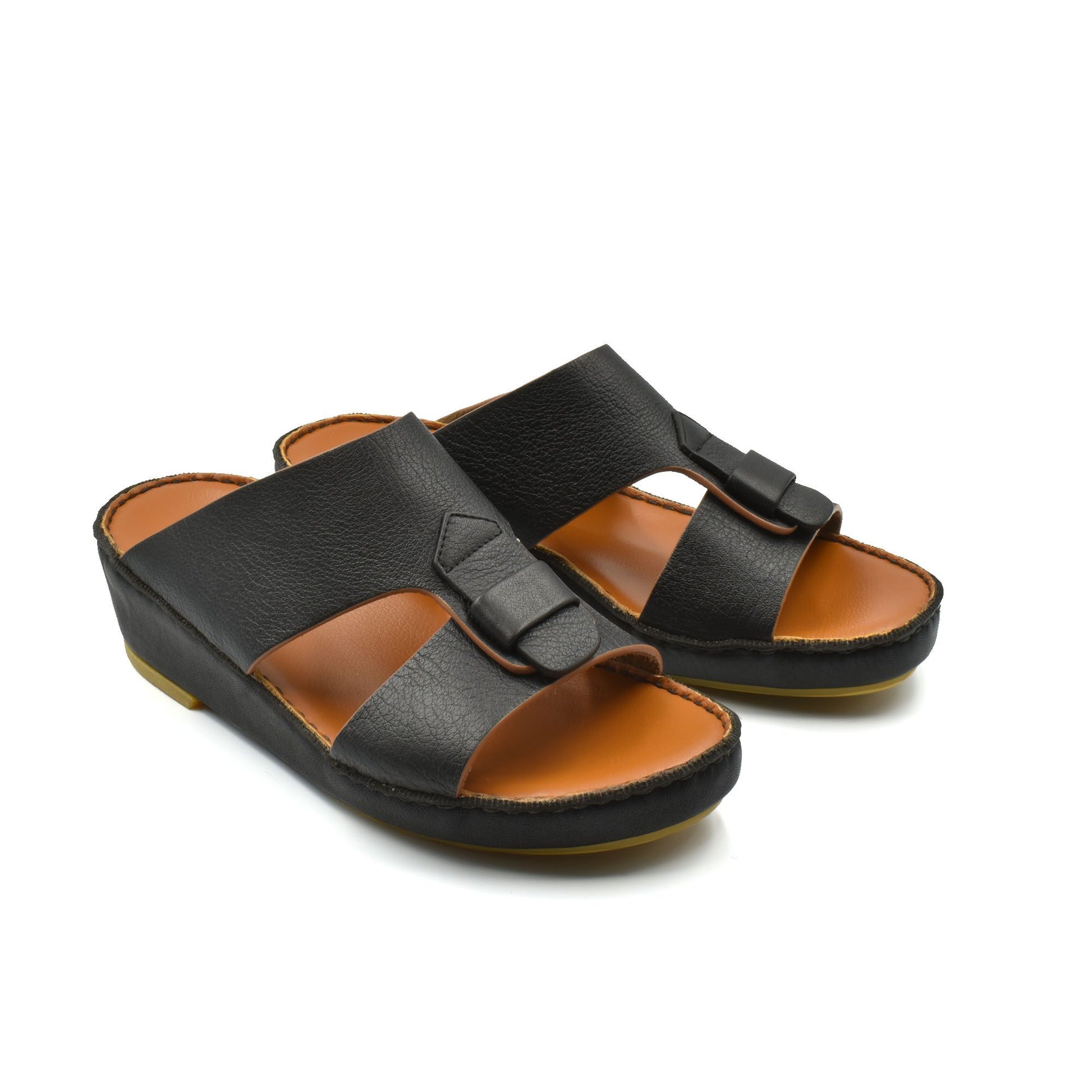 Black granulato leather footwear slip-on sandals with cushioned tan insole and adjustable strap