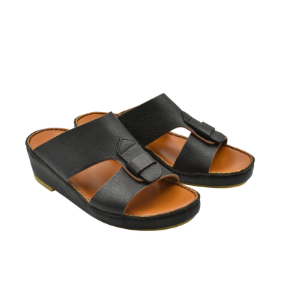 Black granulato leather footwear slip-on sandals with cushioned tan insole and adjustable strap