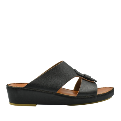 Black granulato leather footwear slide sandal with cushioned sole and adjustable strap