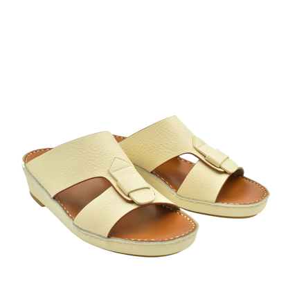 Cream color granulato leather footwear slides with adjustable strap and cushioned sole