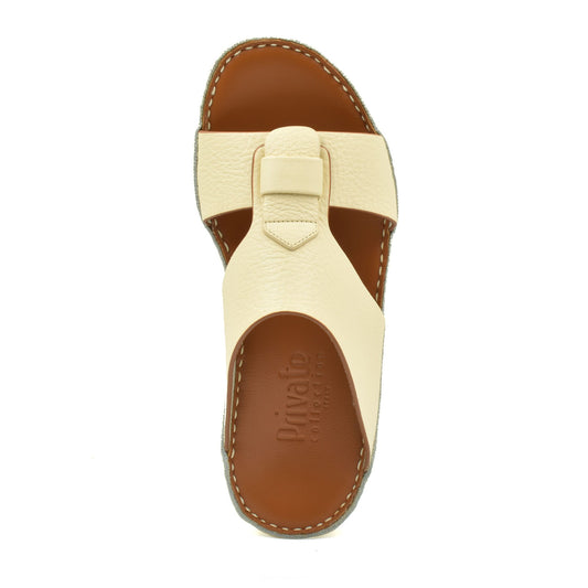 Top view of cream granulato leather footwear sandal with cushioned brown sole from Private collection