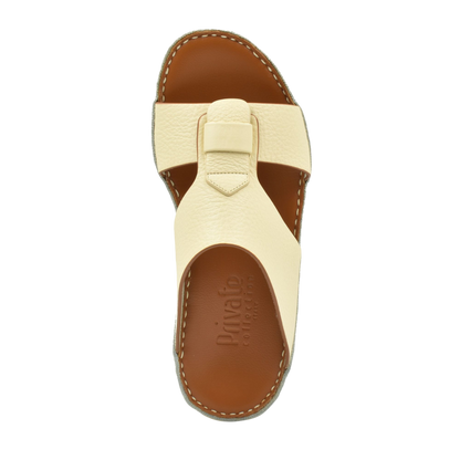Top view of cream granulato leather footwear sandal with cushioned brown sole from Private collection