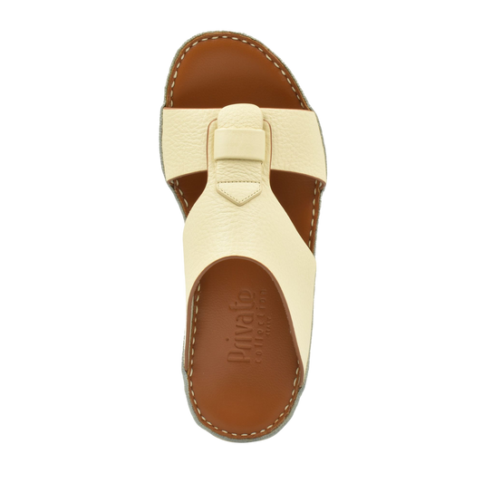 Top view of cream granulato leather footwear sandal with cushioned brown sole from Private collection