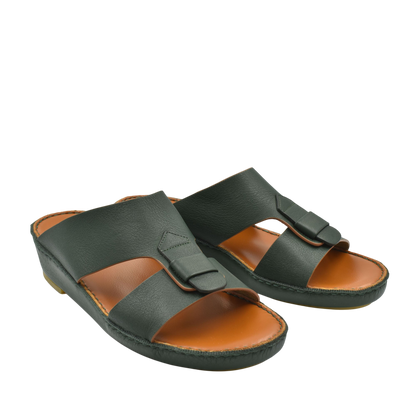 Black granulato leather footwear slide sandals with adjustable buckle straps and tan cushioned footbed