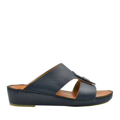 Black granulato leather footwear slide sandal with open toe and adjustable strap in side view