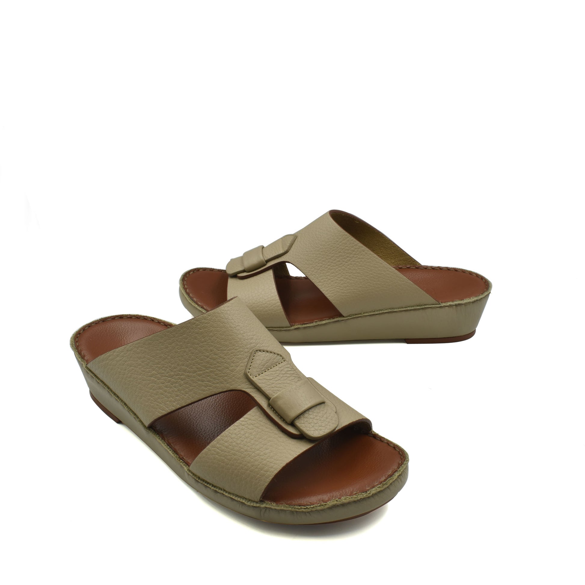 Beige granulato leather footwear slide sandals with adjustable buckle straps and brown insoles