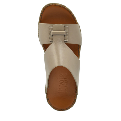 Top view of beige luxury leather sandals with stitched edges and cushioned footbed
