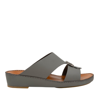 Gray slip-on luxury leather sandals with open toe and low wedge heel from private collection