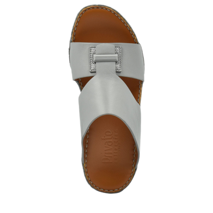 Top view of luxury leather sandals in white with brown cushioned sole by Private Collection