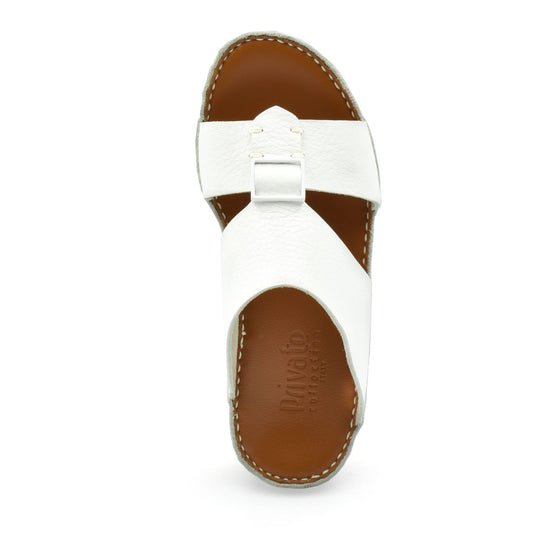 Top view of white luxury leather sandals with brown sole and stitched edges from Private collection