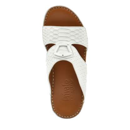 White luxury python sandals with textured straps and brown cushioned footbed from Private Collection