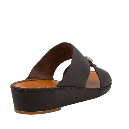 Side view of metallic deercalf slides with brown leather straps and cushioned sole from Private Collection