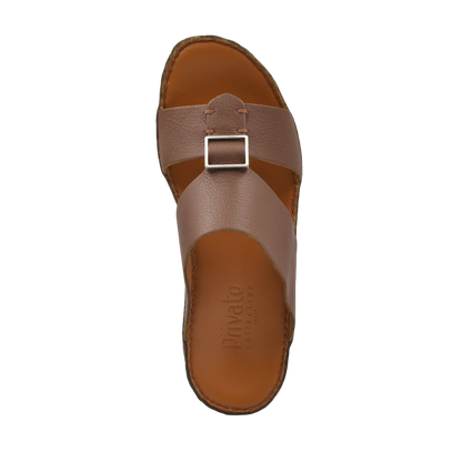 Single brown metallic deercalf slides with buckle strap and cushioned footbed from Private collection