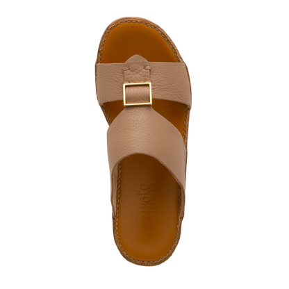 Top view of tan metallic deercalf slides with a gold buckle and stitched sole from private collection