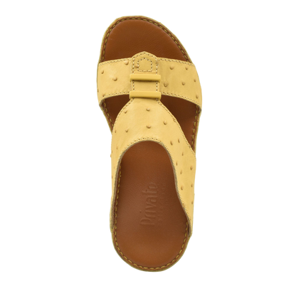 Private Collection beige ostrich leather sandals with open toe and stitched sole design