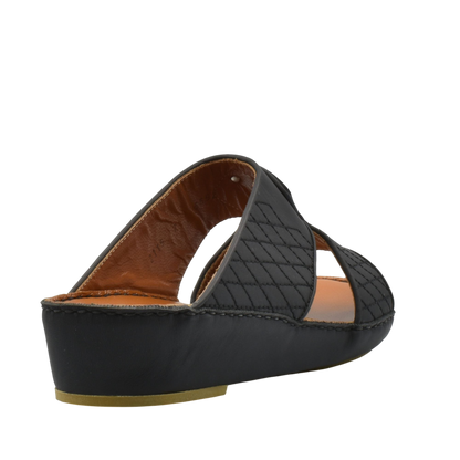 Black premium slip-on sandals with quilted straps and cushioned sole for comfort