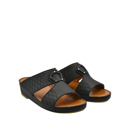 Black premium slip-on sandals with quilted design and buckle detail on brown footbed