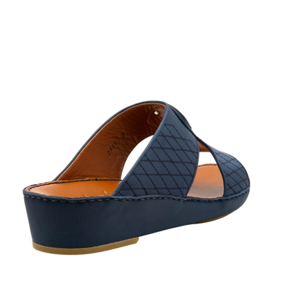 Navy blue premium slip-on sandals with crisscross quilted straps and cushioned sole
