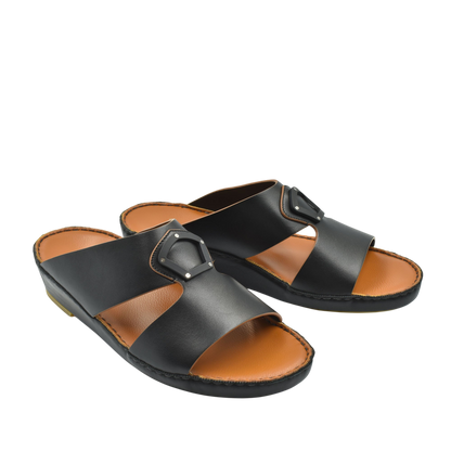 Black natural leather slide shoes with a buckle detail and tan cushioned footbed