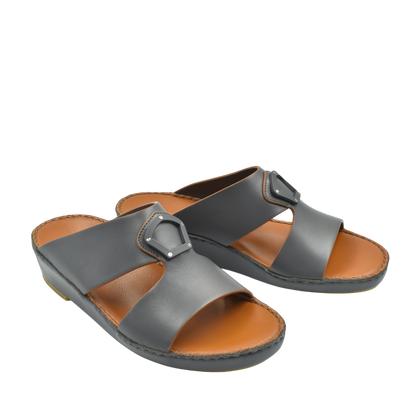 Black natural leather slide shoes with adjustable buckle straps and brown cushioned insoles