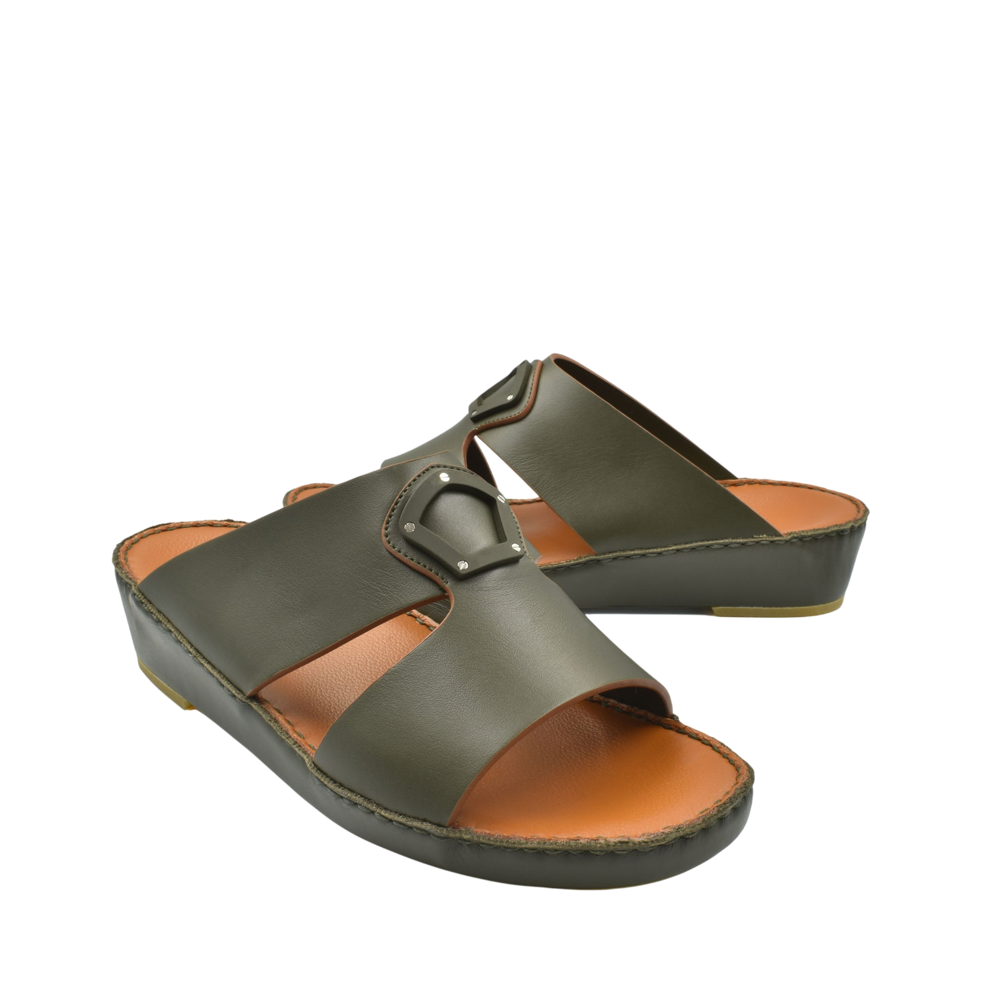 Pair of green natural leather slide shoes with buckle detail and cushioned sole for comfort