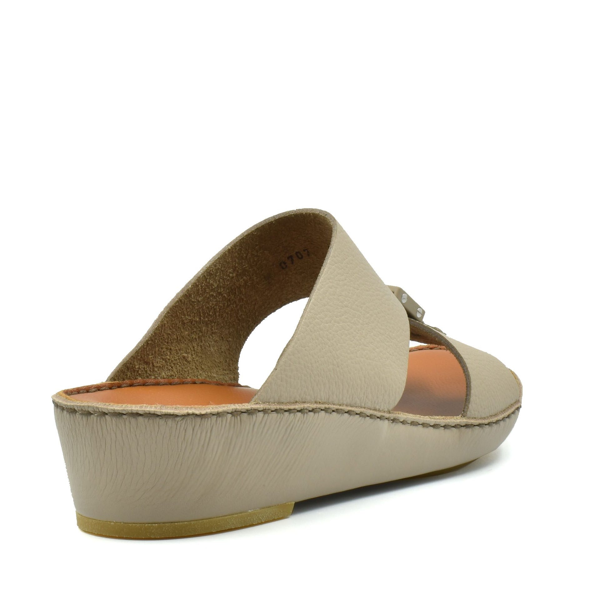 Beige classic leather sandals with low wedge heel and open toe design from Private Collection