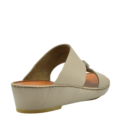 Beige classic leather sandals with low wedge heel and open toe design from Private Collection
