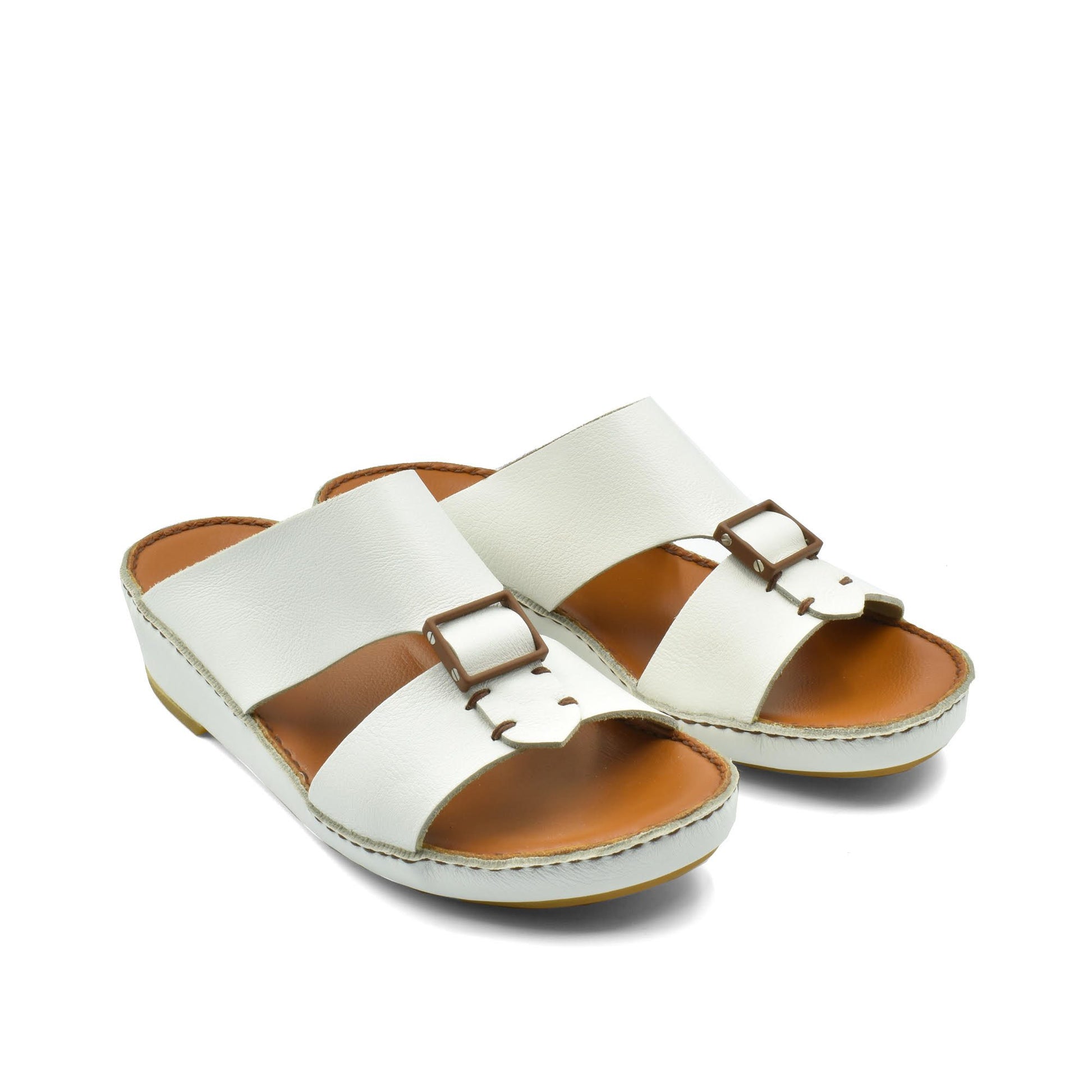 White classic leather sandals with adjustable buckle straps and cushioned brown footbed